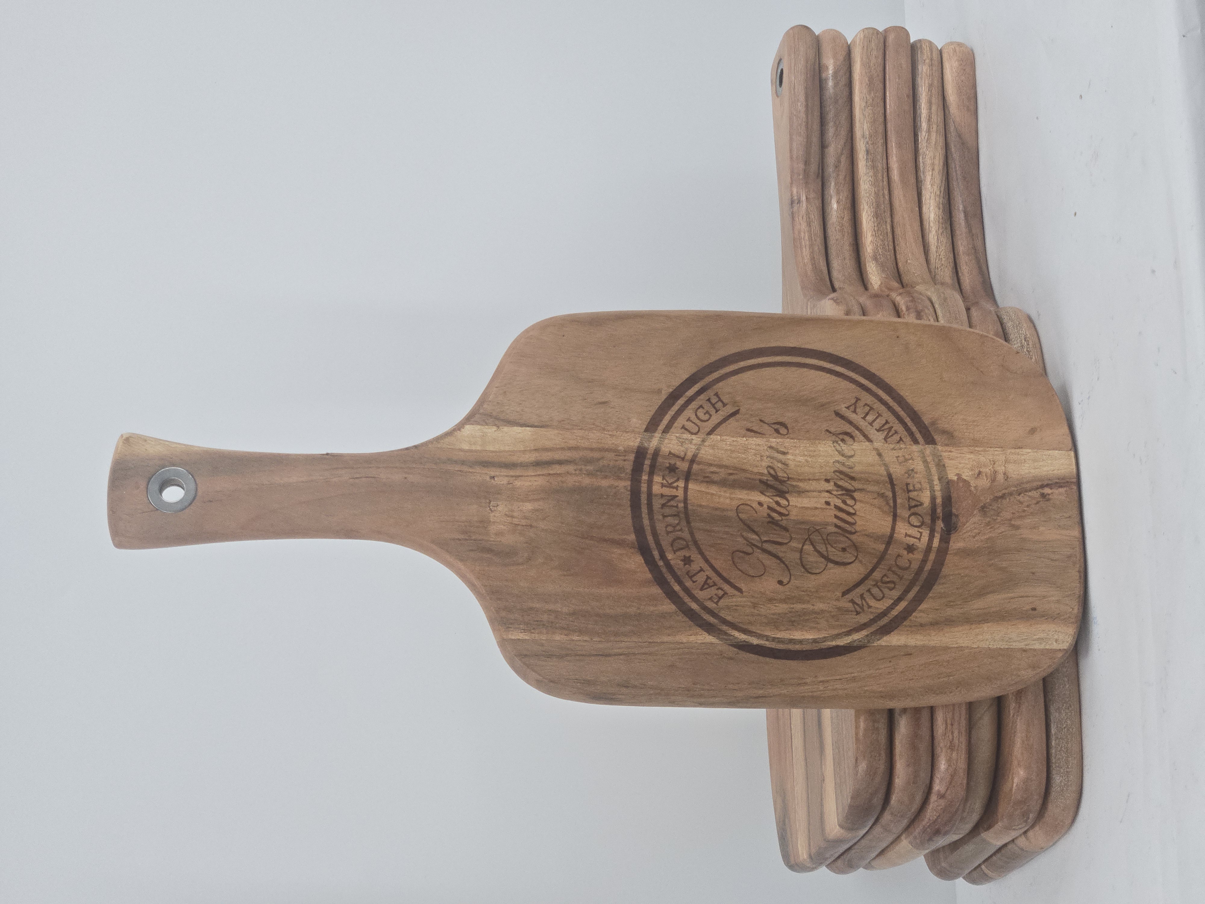 Personalized cutting board for a family kitchen name