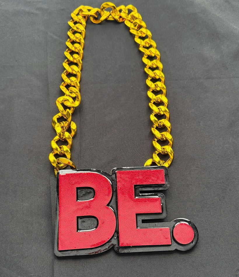 Custom logo chain necklace BE. on a gold Cuban chain